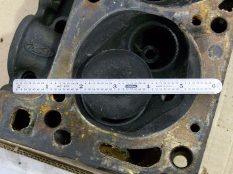 1973 Ford Ranchero - Close-up of a Ford engine cylinder head, showing a piston and a ruler for scale.