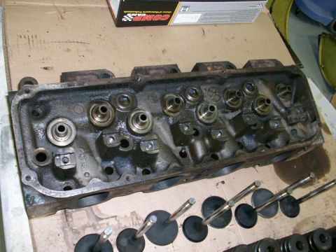 1973 Ford Ranchero - Engine cylinder head and valves, likely for a V8 engine, with a COMP Cams box in the background.