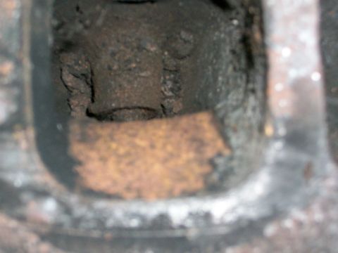 1973 Ford Ranchero - This is a close-up view of an engine's cylinder head, showing significant wear and rust.