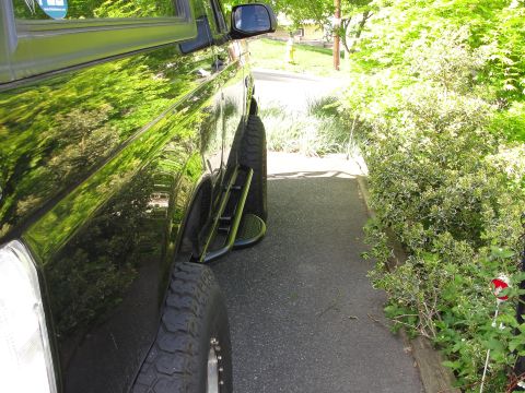 1995 Ford Bronco - Black 1995 Ford Bronco side profile showing aftermarket steps and tires.