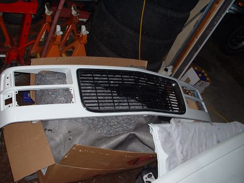 1994 GMC Suburban - Freshly painted grille piece. New carpet underneath in the box.