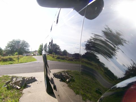 1997 Ford F-150 - Side view of a black 1997 Ford F-150, reflecting the surrounding environment.
