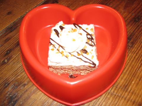 1985 Ford LTD Crown Victoria - A dessert is presented in a heart-shaped dish, ready to be enjoyed.