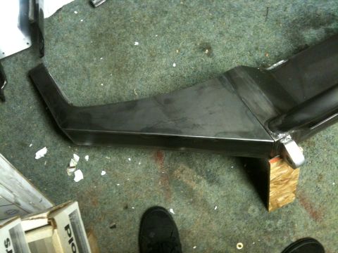 1995 Ford Bronco - A custom metal bumper part is shown in a workshop setting.