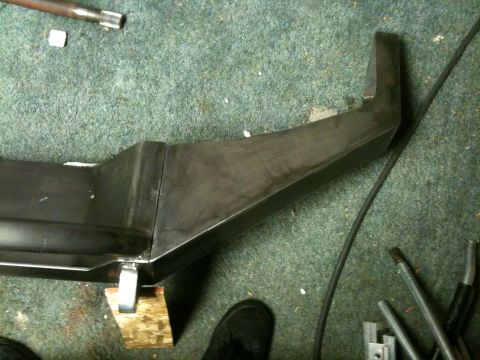 1995 Ford Bronco - A custom fabricated metal bumper is shown, likely for an off-road vehicle. The part is in a workshop setting.