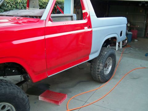 1985 Ford Bronco - Ford Bronco body panels are being worked on, showing a side view of the vehicle during repair.