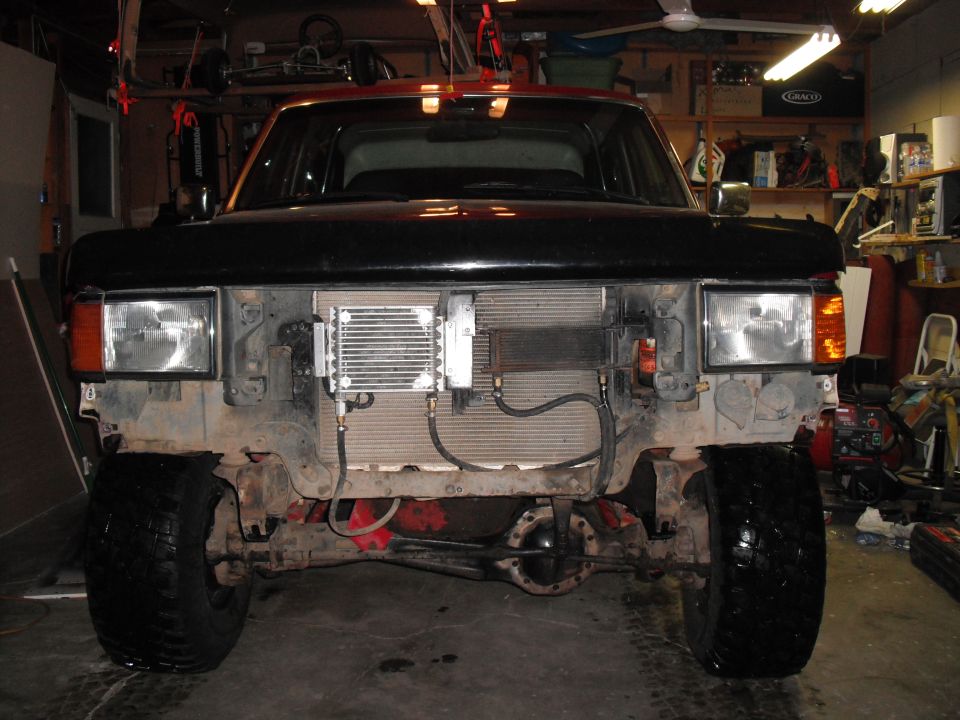 Front view of truck with grille removed, showing aftermarket oil cooler