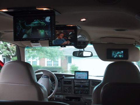 2001 Ford Excursion - The interior of a 2001 Ford Excursion is equipped with multiple screens for entertainment and navigation.