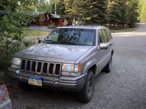 1990 Chevrolet Suburban - This Jeep Grand Cherokee appears to be from the mid-1990s, not a 1990 Chevrolet Suburban.