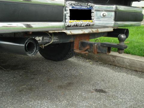 1988 Ford Bronco - Truck's rear bumper, hitch assembly, and dual exhaust pipes are visible, along with a Pennsylvania license plate.
