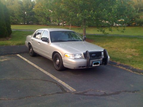 2009 Ford Crown Victoria - Silver 2009 Ford Crown Victoria parked in a lot with a push bar.