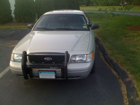 2009 Ford Crown Victoria - This 2009 Ford Crown Victoria is parked in a driveway with a push bar on the front.