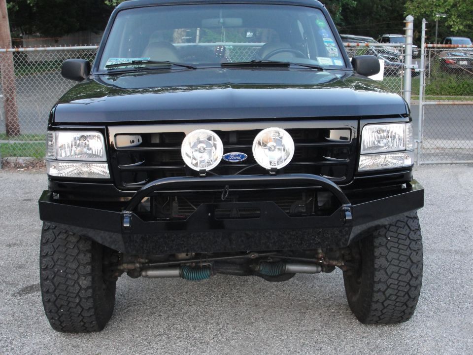 Black Ford Bronco front view with aftermarket bumper and auxiliary lights