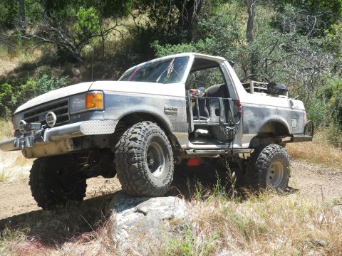 1991 Ford Bronco - This modified 1991 Ford Bronco is shown navigating a rocky off-road path.