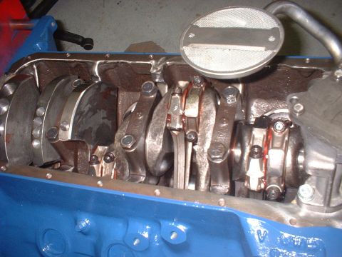 1968 Ford Mustang - Close-up view of an engine's internal components, including the crankshaft and connecting rods.