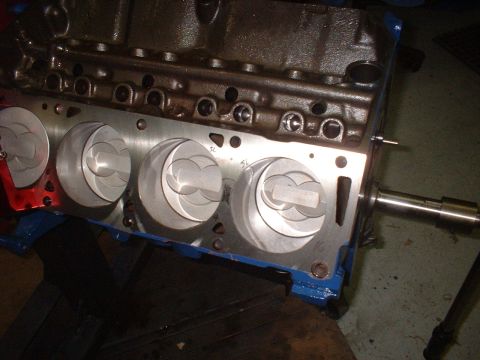 1968 Ford Mustang - Close-up of an engine block with pistons and cylinder bores visible, ready for assembly.