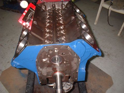 1968 Ford Mustang - Close-up of an engine block being measured with a dial indicator, likely for engine building or repair.