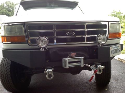 1996 Ford Bronco - This Ford truck features a heavy-duty bumper and winch, suggesting off-road use.