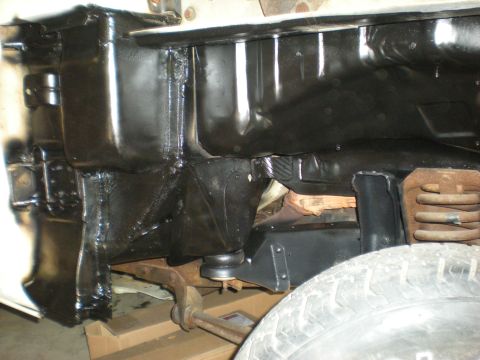 1978 Ford Bronco - Undercarriage view showing frame, suspension, and a tire.