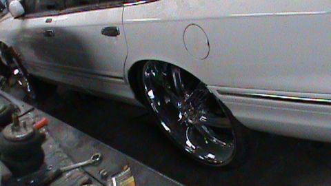 1997 Ford Crown Victoria - sitting on 26 inch rims .. damm