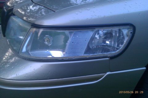 2000 Mercury Grand Marquis - Headlight assembly on a 2000 Mercury Grand Marquis.