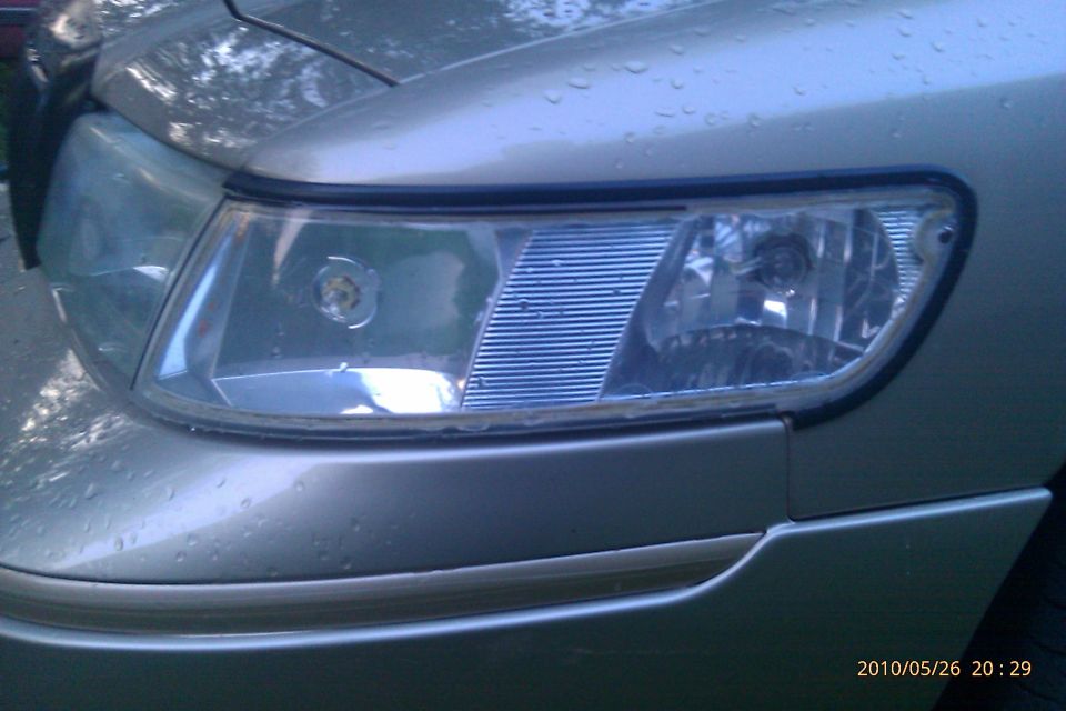 Close-up of a 2000 Mercury Grand Marquis headlight assembly