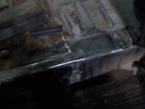 1991 Ford F-150 - Metal framing and floor panels are visible in this close-up view.