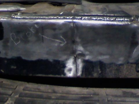1991 Ford F-150 - A close-up view of a welded metal frame shows handwritten text and an arrow.