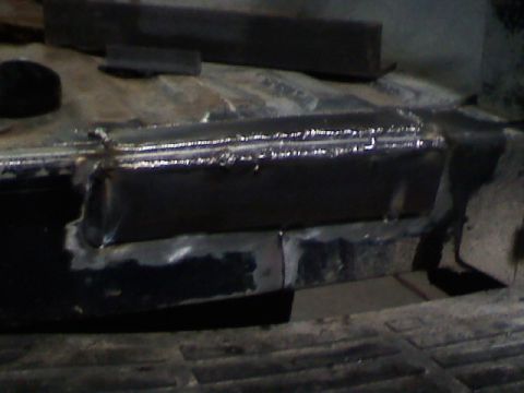 1991 Ford F-150 - Close-up view of a welded metal frame section, possibly from a vehicle repair or fabrication project.