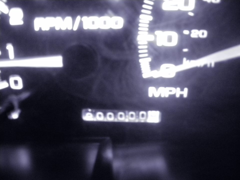 Vehicle odometer showing 000000, tachometer reads 0 RPM/1000, and speedometer reads 0 MPH
