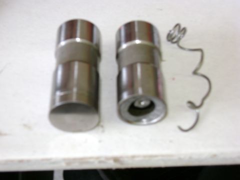 1972 Ford Ranchero - Hydraulic valve lifters and a spring, likely for an engine rebuild or repair.