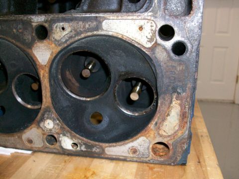 1973 Ford Ranchero - Close-up view of an engine cylinder head, showing the combustion chambers and valves.