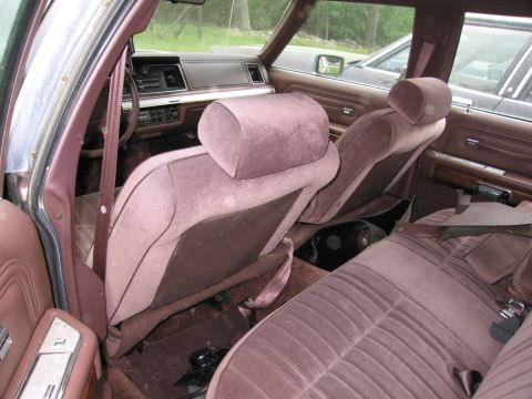 1991 Ford LTD Crown Victoria - Interior view of a 1991 Ford Crown Victoria LTD, showing the front and rear seats and dashboard.