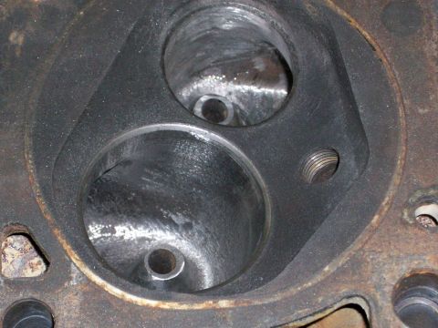 1973 Ford Ranchero - This image shows a close-up view of an engine cylinder head, focusing on the intake ports and combustion chambers.