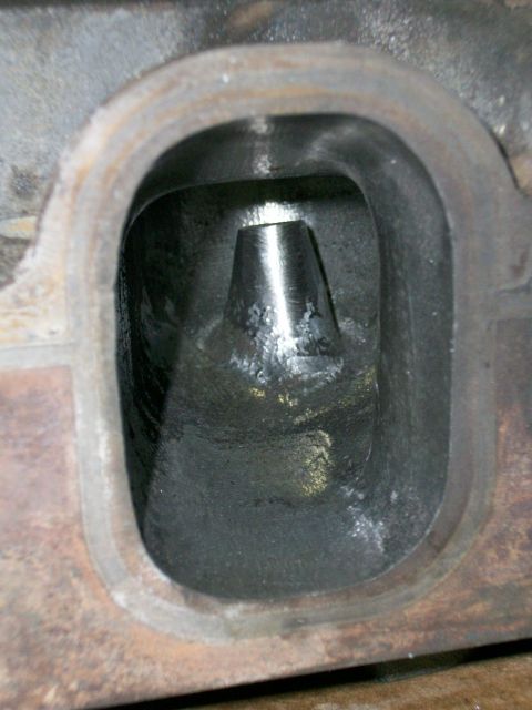 1973 Ford Ranchero - Engine cylinder head intake port showing the valve guide and port shape.