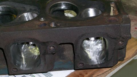 1973 Ford Ranchero - Close-up of an engine cylinder head, showing polished intake ports and valve seats. The registry claims it is from a 1973 Ford Ranchero, bu…