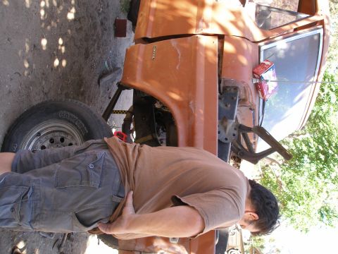 1969 Ford F-250 - The fender of a 1969 Ford F-250 is removed, revealing the wheel and suspension components.