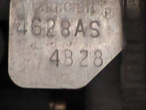 1968 Ford Mustang - A close-up view of a stamped metal plate showing alphanumeric characters and numbers.
