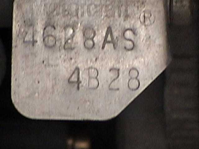 Metal part stamped 4628AS and 4B28 with trademark mark