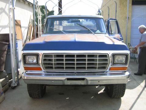 1979 Ford F-150 - Front view of a 1979 Ford F-150 truck with a blue hood and chrome bumper.
