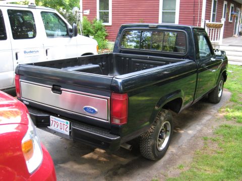 1989 Ford Ranger - Rear view of a 1989 Ford Ranger pickup truck, parked outdoors.