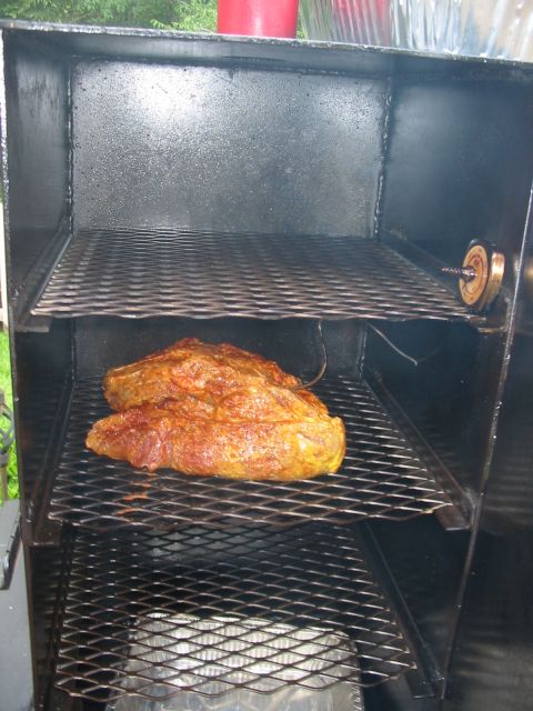 1992 Ford Bronco - Meat is being smoked on racks inside a metal smoker with a visible temperature gauge.