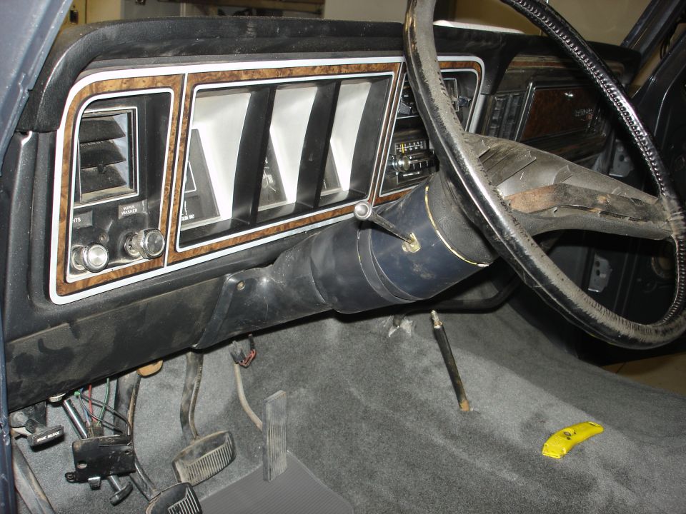 1979 Ford F-250 interior dashboard with woodgrain trim and steering wheel