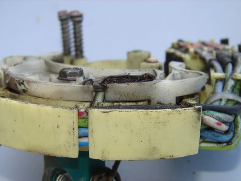 1973 Ford Ranchero - This electrical connector shows signs of damage and wear, with exposed wires and a broken housing.