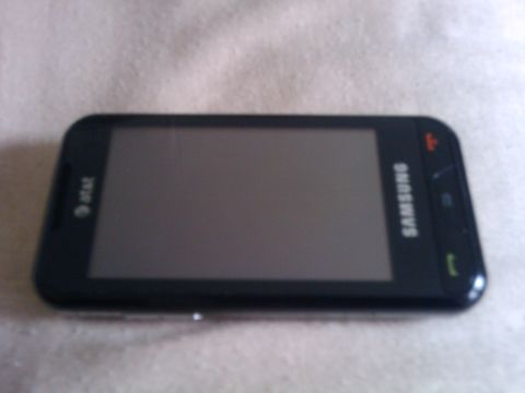 1995 Mercury Cougar - A Samsung smartphone with the AT&T logo is visible on a textured surface.