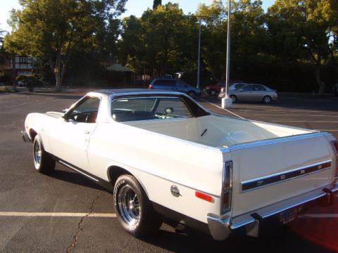 1973 Ford Ranchero - Rear view of a 1973 Ford Ranchero pickup truck with a cream exterior and black vinyl roof.
