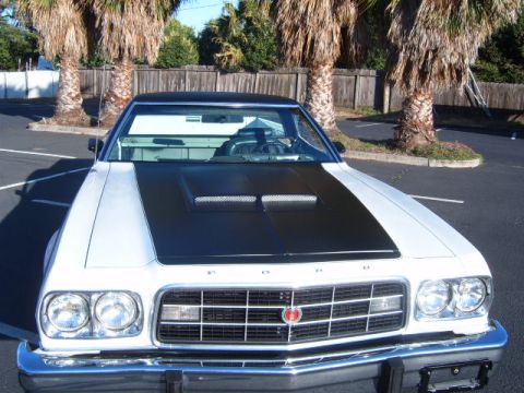 1973 Ford Ranchero - This 1973 Ford Ranchero features a distinctive black hood scoop and a two-tone paint scheme.