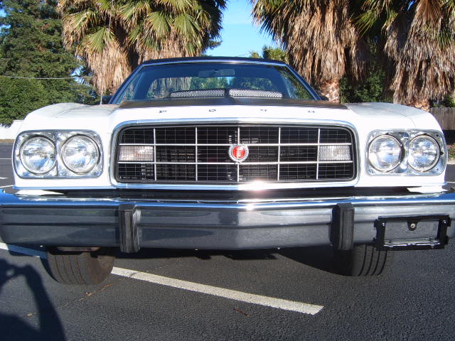 1973 Ford Ranchero front view, white paint, black hood accent, chrome bumper
