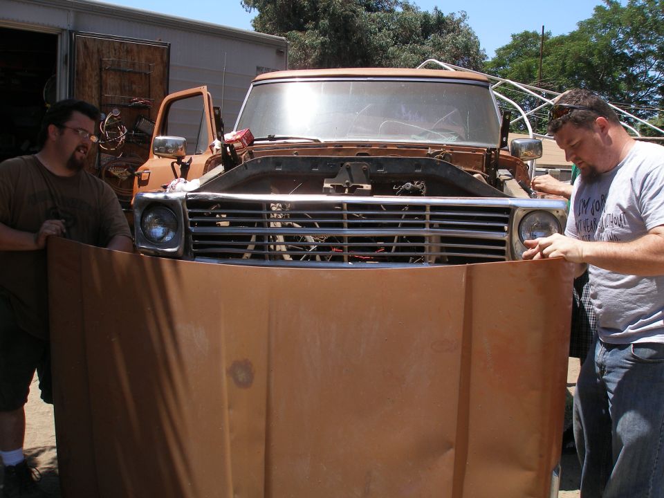 Truck front end with horizontal grille and round headlights, likely 1973-1979 Ford F-Series