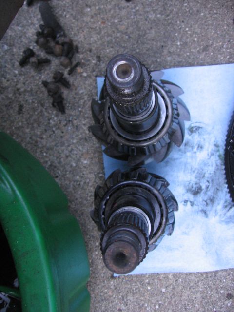 1989 Ford Bronco - Differential ring gears and associated hardware laid out on a blue shop towel.